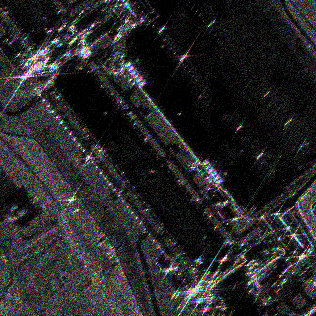 Rung 5a render: colorized sub-aperture composite — gray static scene with colored aspect-dependent scatterers